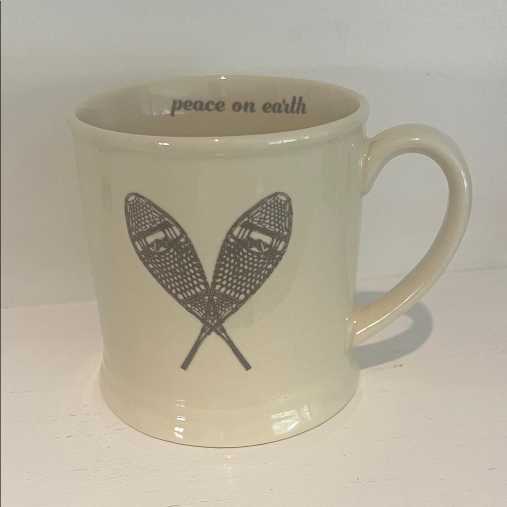 Cream Ceramic Mug with Snowshoe Design